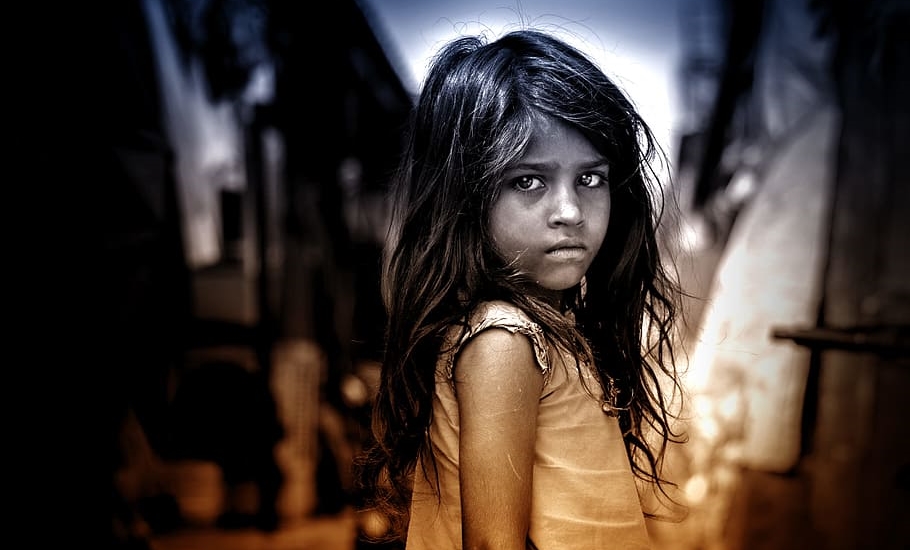 Heartbroken look in the eyes of little refugee girl