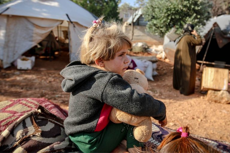 refugee child with toys