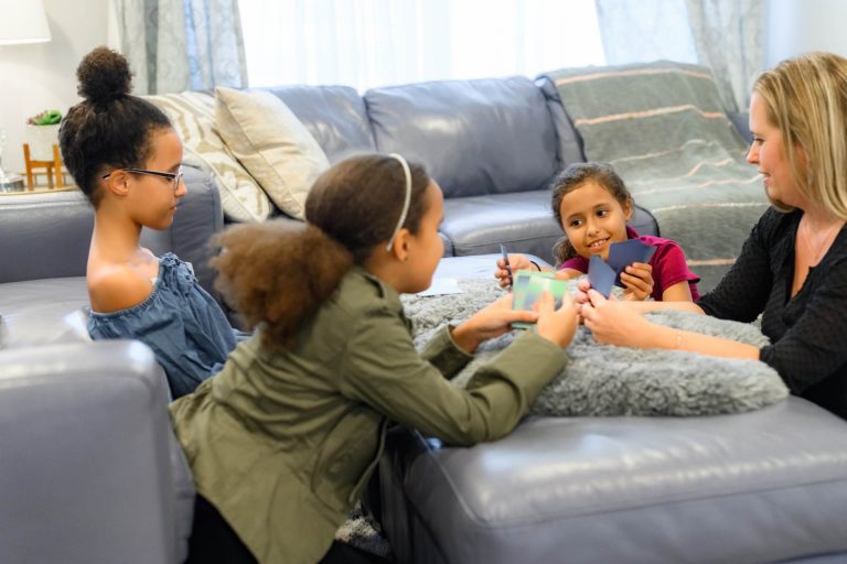 mother playing indoor games with her children