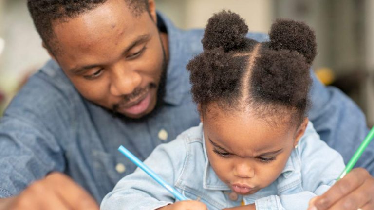 dad teaching daughter