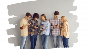 group of teens looking at the phone