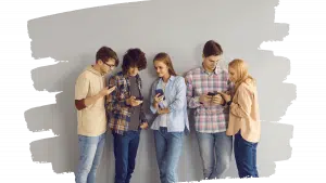 group of teens looking at the phone