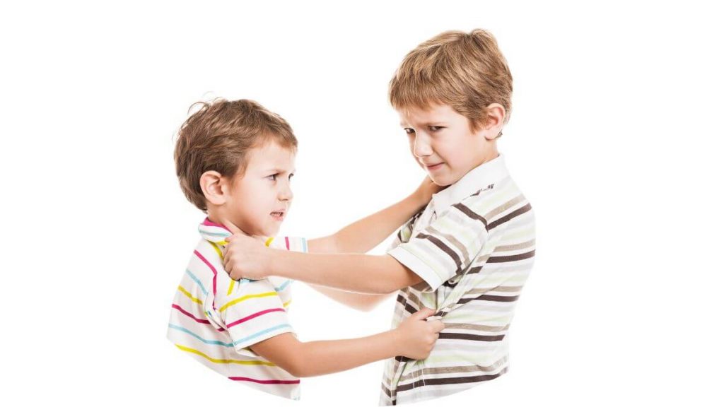 an image of two children holding each other aggressively