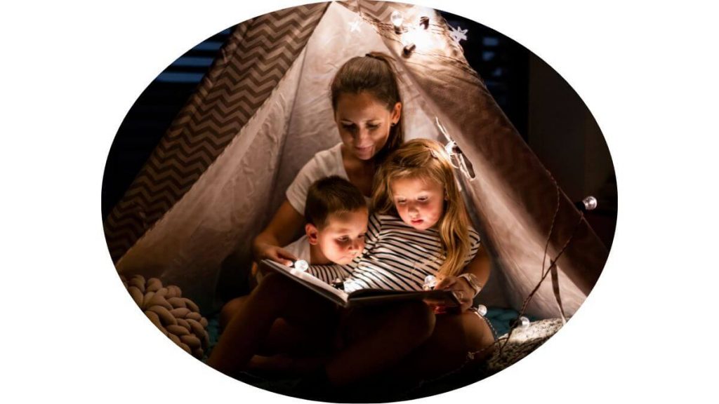 an image of a mother reading to her children in a great ambiance