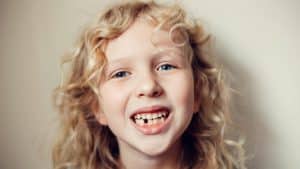 A portrait of a child with early puberty